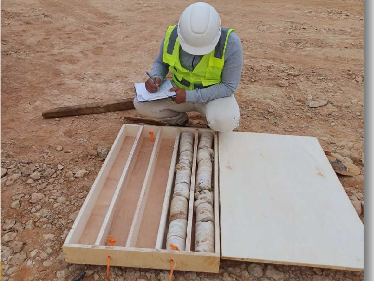 SAMCOMINE geologist recording drill core samples
